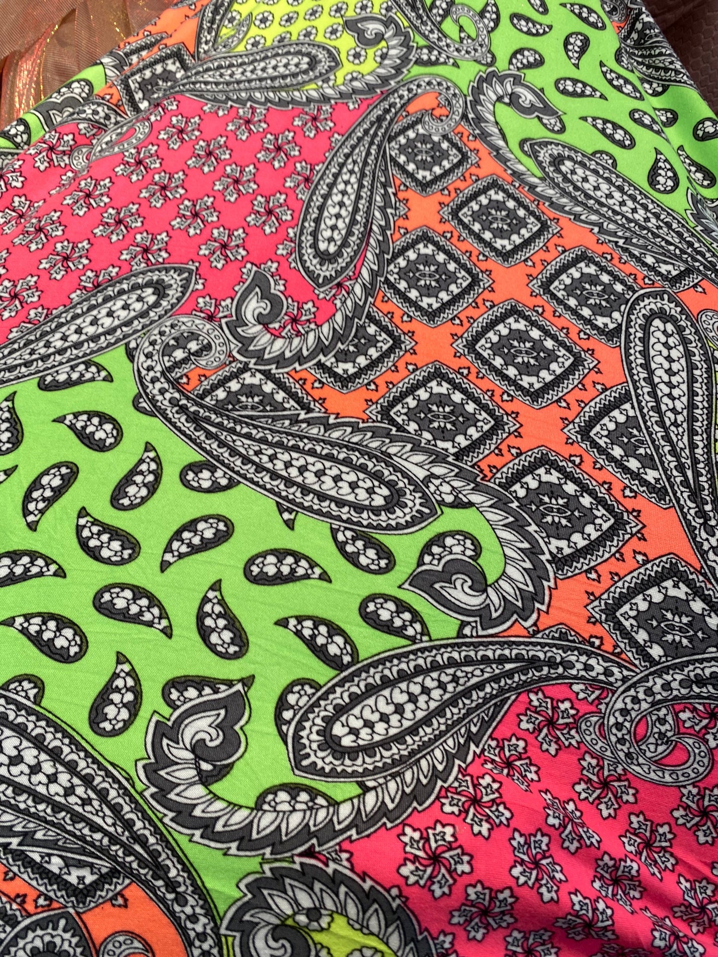 New paisley designs neon colors print on poly spandex jersey 4-way stretch medium weight 58/60” Sold by the YD. Ships Worldwide from L.A CA.