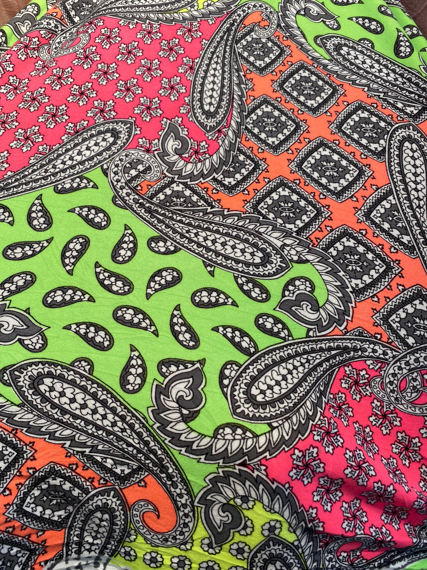 New paisley designs neon colors print on poly spandex jersey 4-way stretch medium weight 58/60” Sold by the YD. Ships Worldwide from L.A CA.