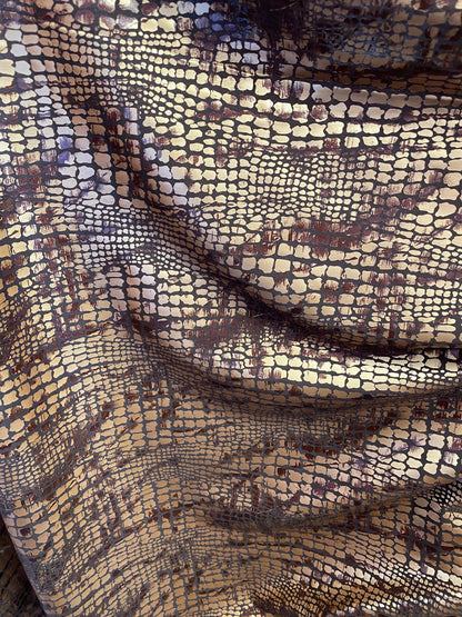 New Exotic animal print on metallic polyester non stretch 58/60” Sold by the YD. Ships Worldwide from Los Angeles California USA.