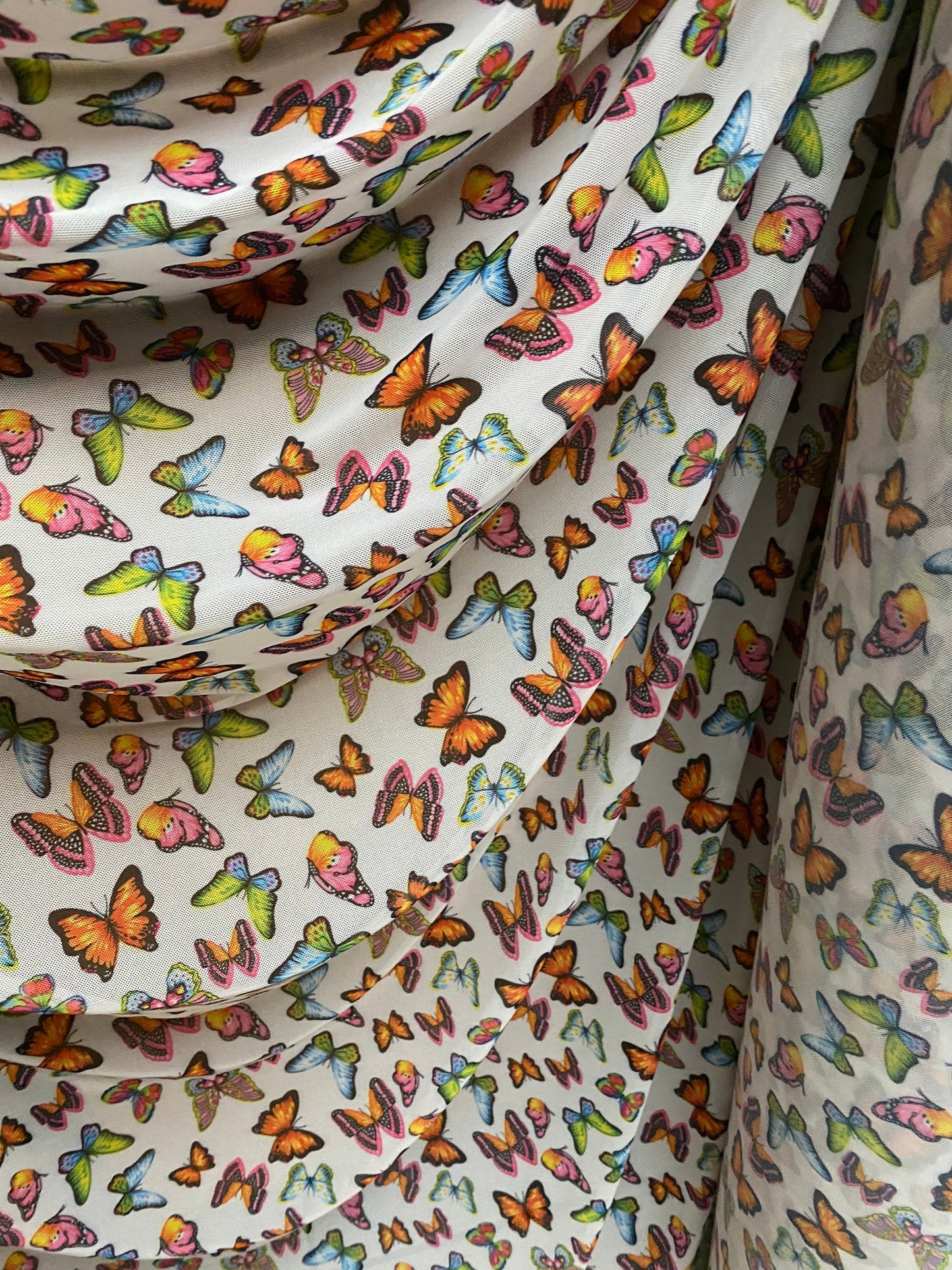 New butterflies design multicolor print on good quality stretch power mesh 4-way stretch 58/60” Sold by the YD. Ships worldwide from Los Ang