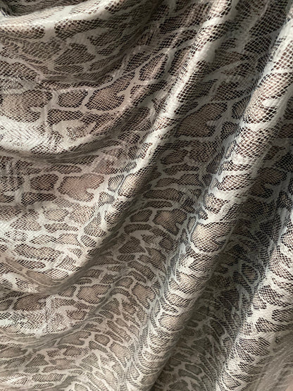 New Exotic snake design with clear foil print on poly spandex 2-way stretch Olive/Black/Taupe 58/60” Sold by the YD. Ships Worldwide