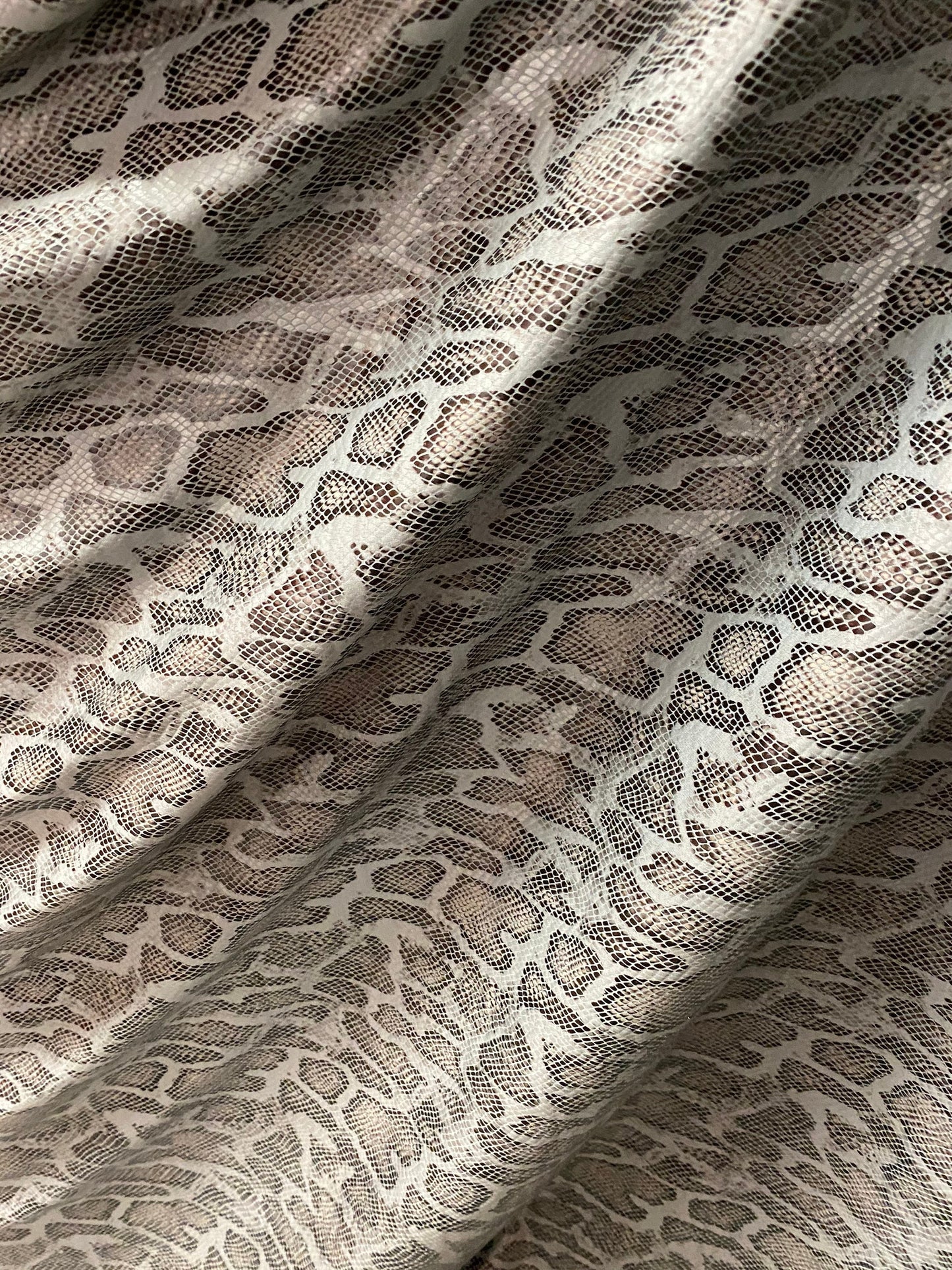 New Exotic snake design with clear foil print on poly spandex 2-way stretch Olive/Black/Taupe 58/60” Sold by the YD. Ships Worldwide