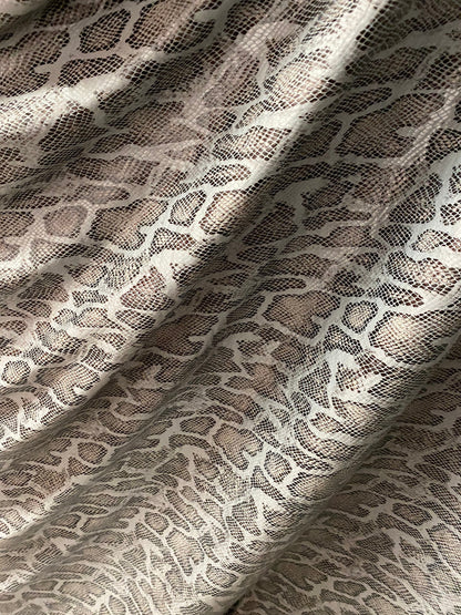 New Exotic snake design with clear foil print on poly spandex 2-way stretch Olive/Black/Taupe 58/60” Sold by the YD. Ships Worldwide