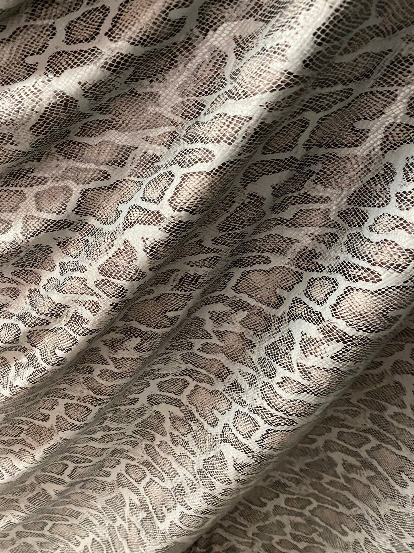 New Exotic snake design with clear foil print on poly spandex 2-way stretch Olive/Black/Taupe 58/60” Sold by the YD. Ships Worldwide