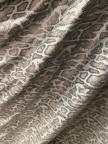 New Exotic snake design with clear foil print on poly spandex 2-way stretch Olive/Black/Taupe 58/60” Sold by the YD. Ships Worldwide