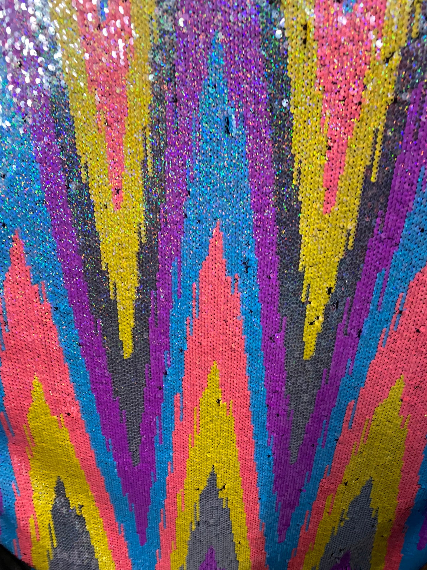 New chevron design multicolor rainbow sequins on stretch mesh 2-way 55/57” Sold by the YD. Ships worldwide from Los Angeles California USA.