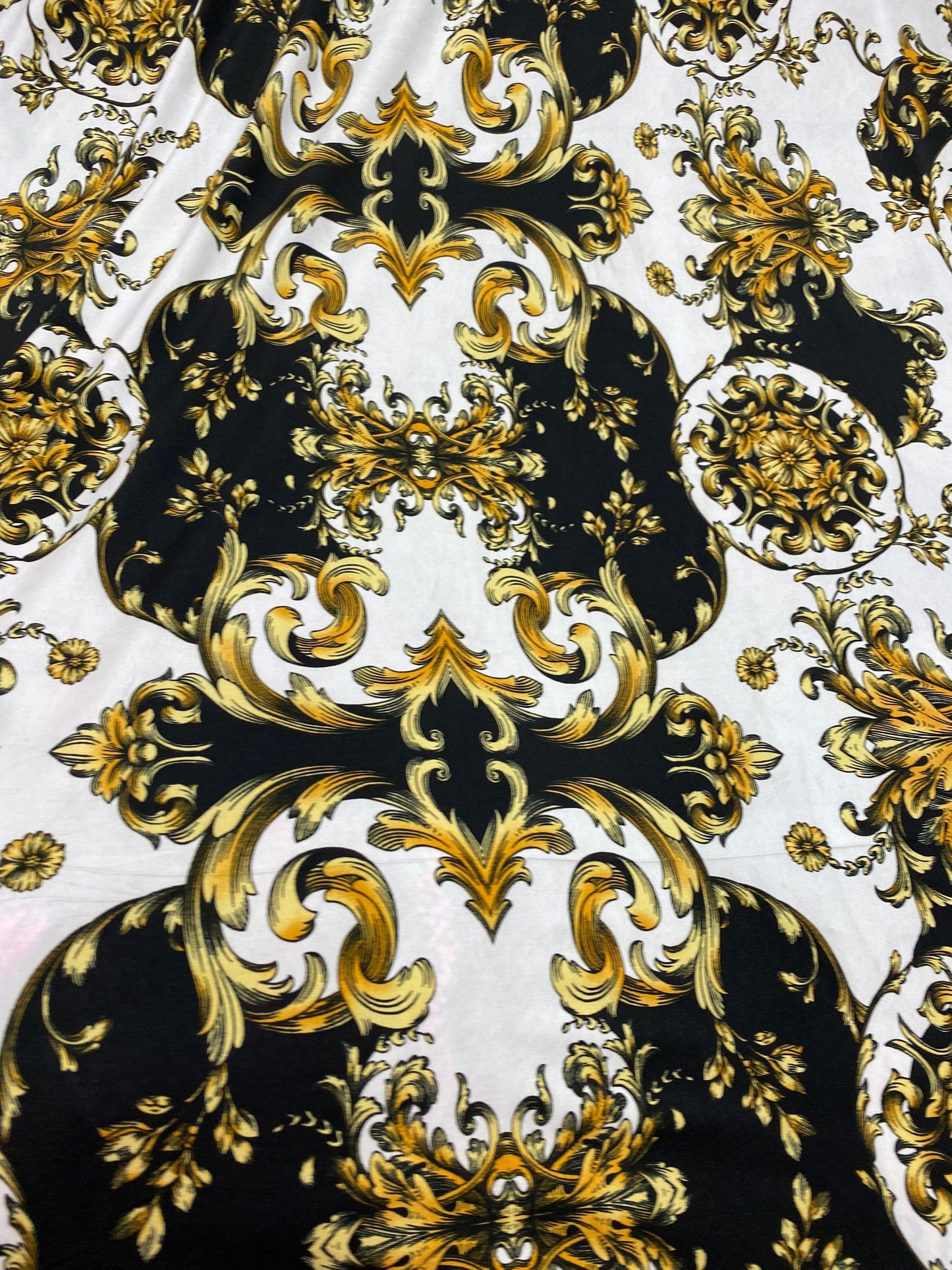 New Black/cold designer fabric print on poly spandex medium weight 4-way stretch 58/60” Sold by the YD. Ships Worldwide from Los Angeles CA.
