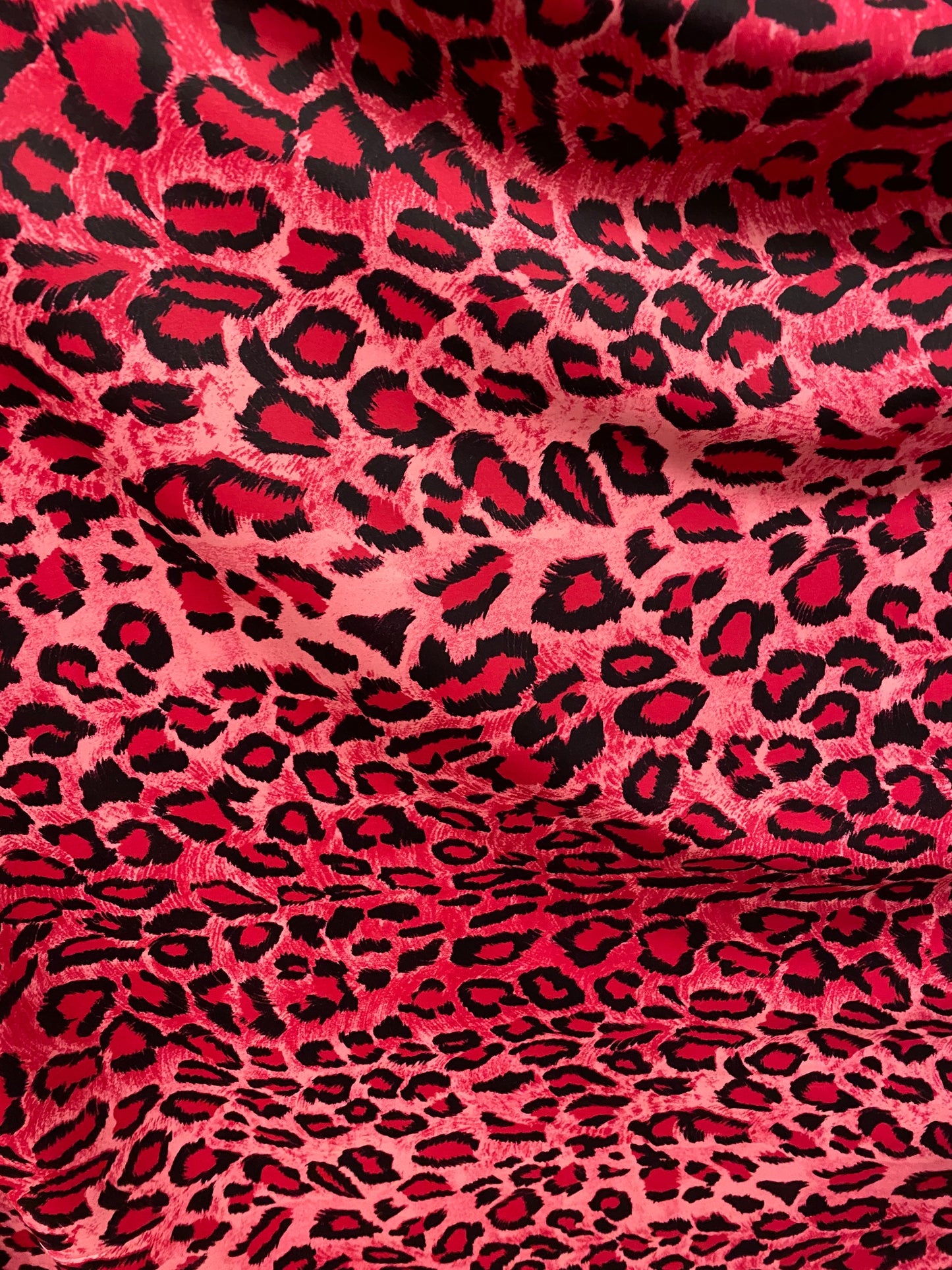 Exotic leopard design pink/black print on nylon spandex 4-way stretch 58/60” Sold by the YD. Ships worldwide from Los Angeles California U