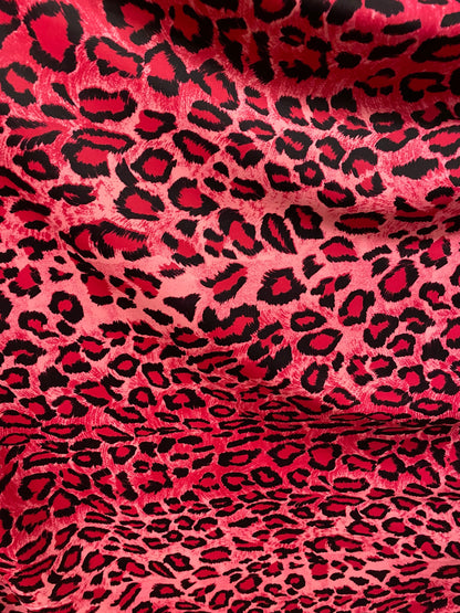 Exotic leopard design pink/black print on nylon spandex 4-way stretch 58/60” Sold by the YD. Ships worldwide from Los Angeles California U