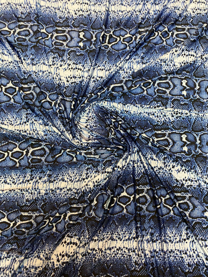 New snake skin sapphire/blue color print on poly spandex light weight 4-way stretch 58/60” Sold by the YD. Ships Worldwide from Los Angeles