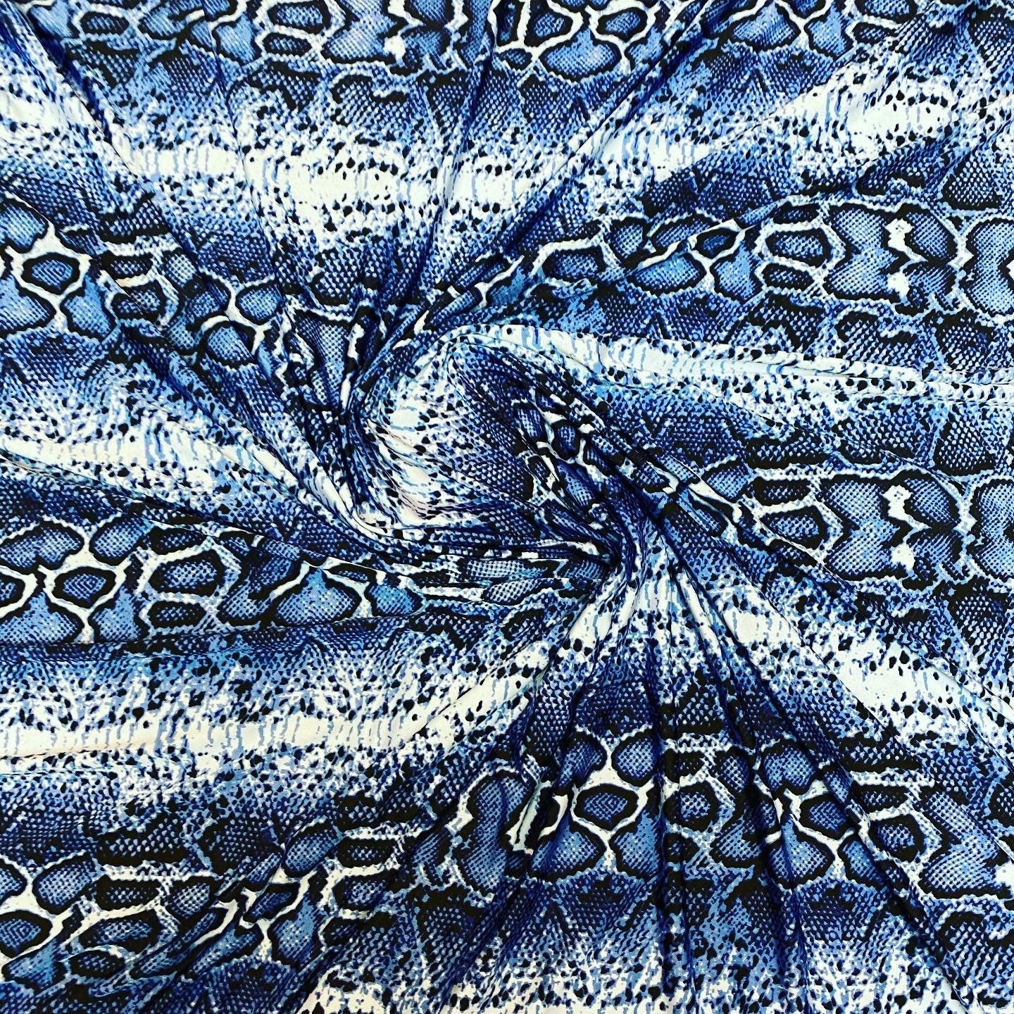New snake skin sapphire/blue color print on poly spandex light weight 4-way stretch 58/60” Sold by the YD. Ships Worldwide from Los Angeles
