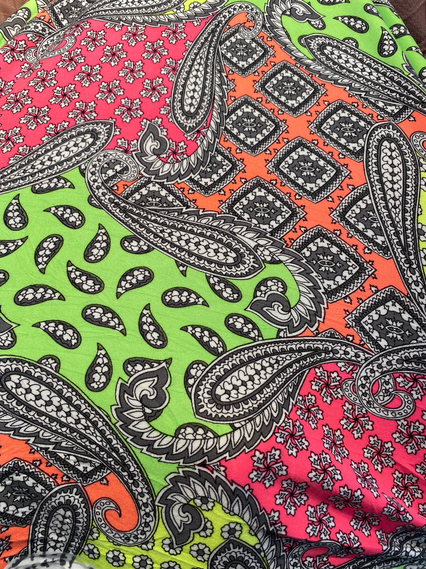 New paisley designs neon colors print on poly spandex jersey 4-way stretch medium weight 58/60” Sold by the YD. Ships Worldwide from L.A CA.