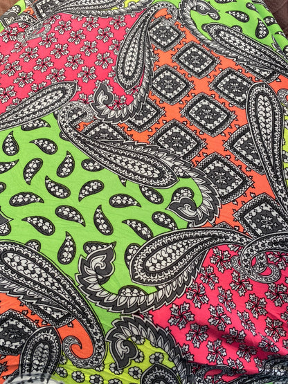 New paisley designs neon colors print on poly spandex jersey 4-way stretch medium weight 58/60” Sold by the YD. Ships Worldwide from L.A CA.