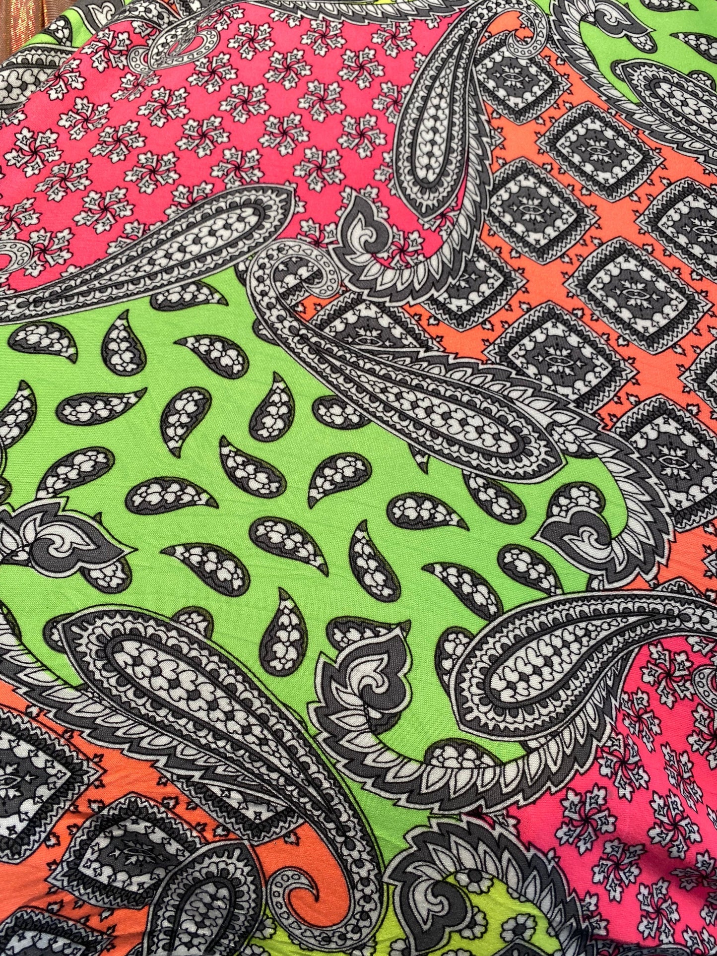 New paisley designs neon colors print on poly spandex jersey 4-way stretch medium weight 58/60” Sold by the YD. Ships Worldwide from L.A CA.
