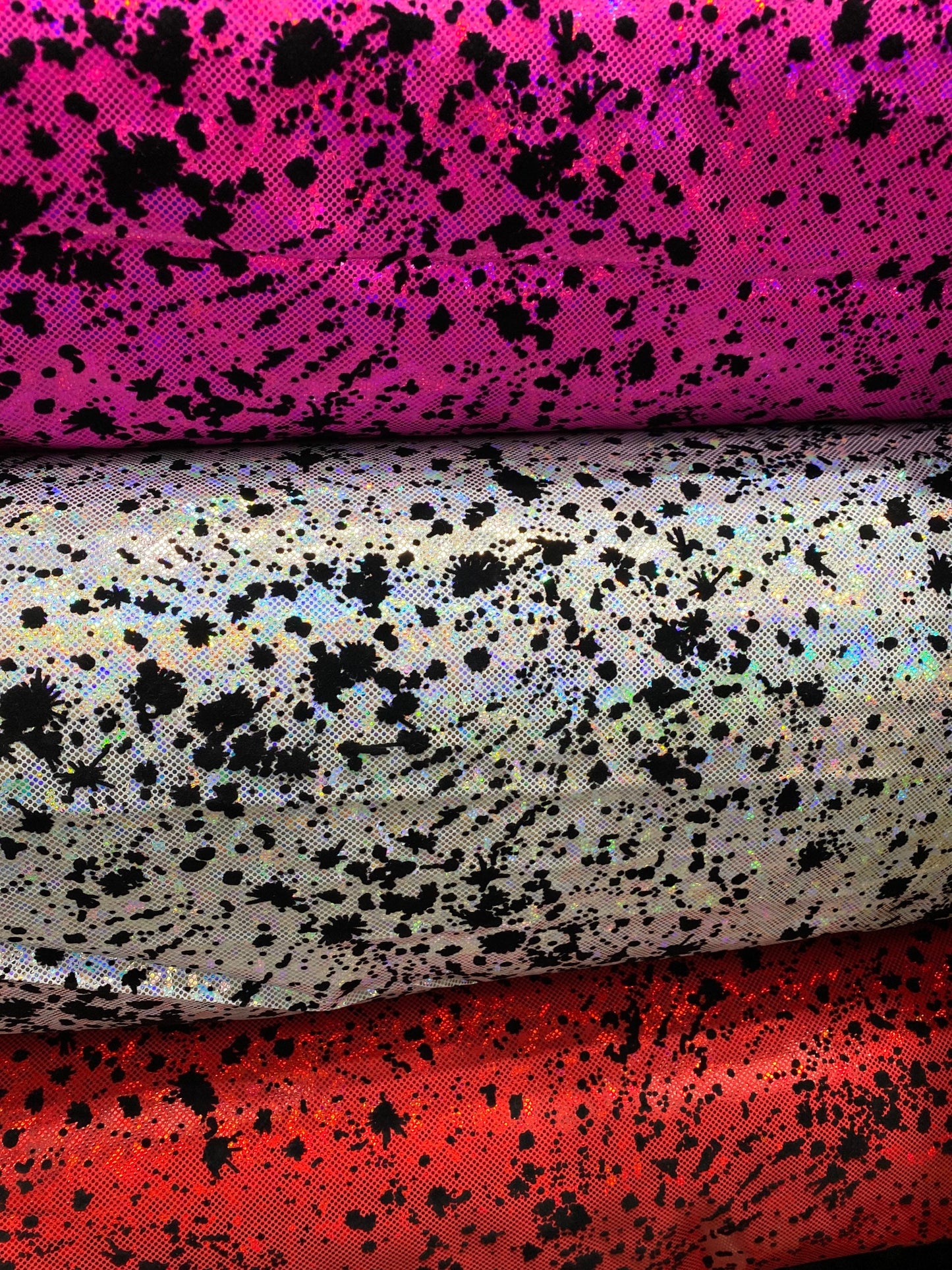 New splatter paint design print with flocking in hologram shattered glass metallic nylon spandex 4-way stretch 58/60” Sold by the YD.