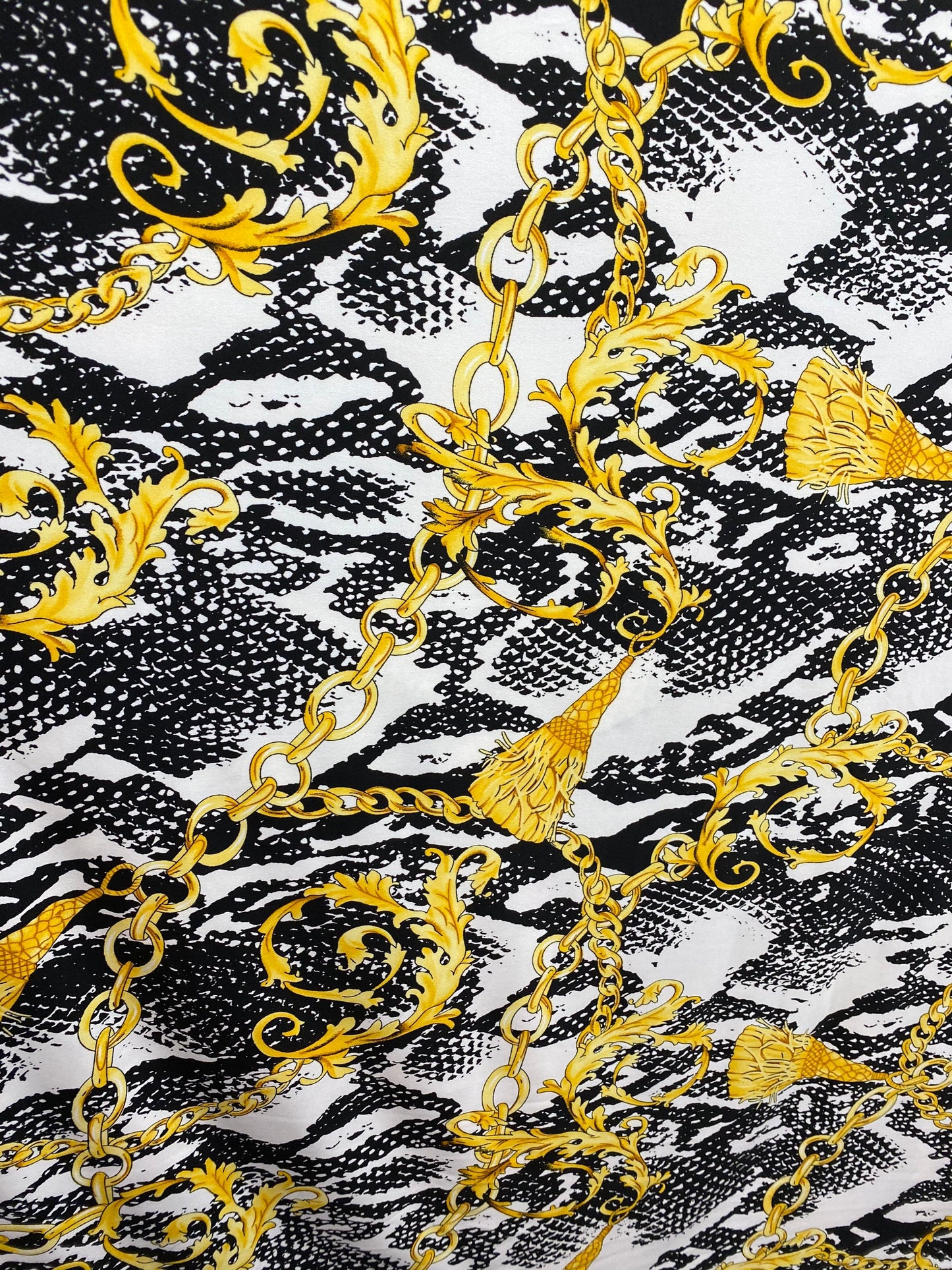 New brand design animal print with gold chains and tassels print on poly spandex 4-way stretch medium weight 58/60” Sold by the YD.