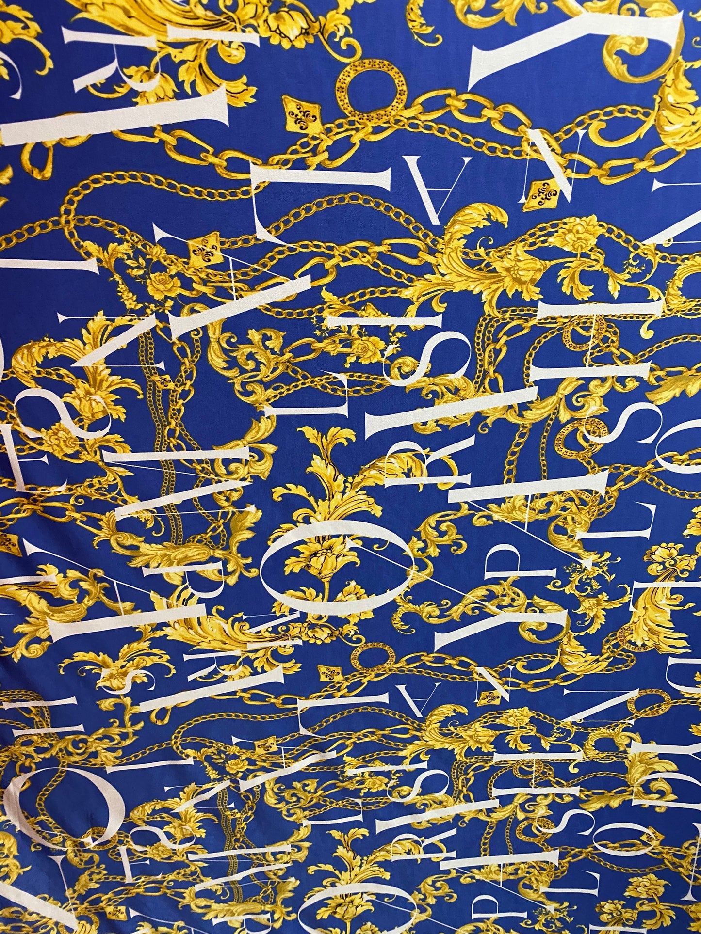 New brand design sapphire with gold chain print on poly spandex 4-way stretch 58/60” Sold by the YD. Ships worldwide from Los Angeles CA USA