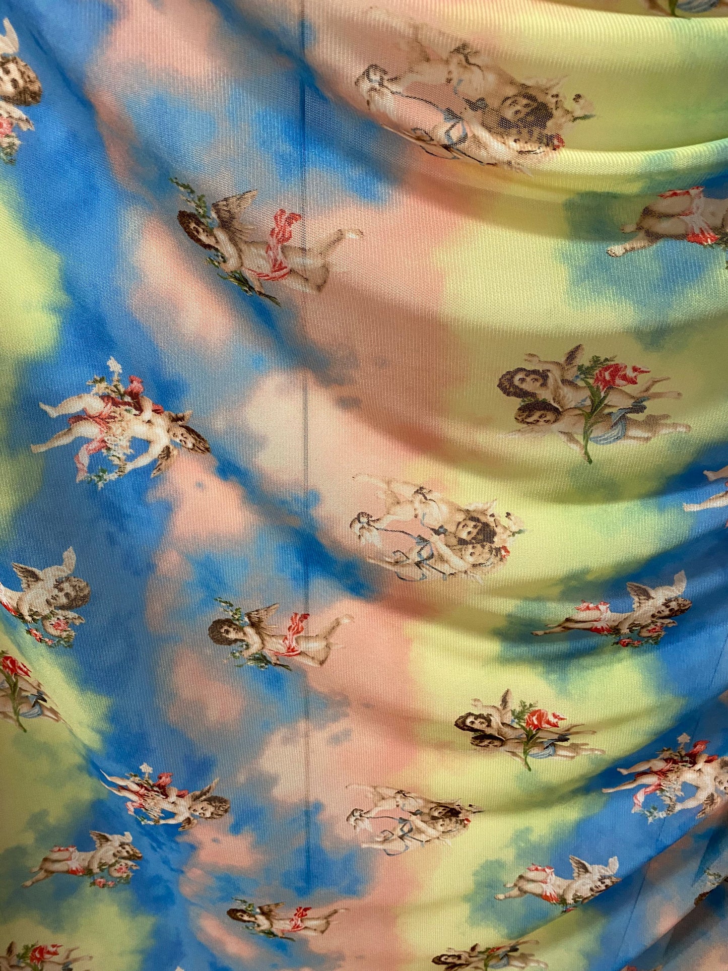 New Divine Angels design blush/blue/yellow print on power mesh 4-way stretch 58/60” Sold by the YD. Ships worldwide from Los Angeles