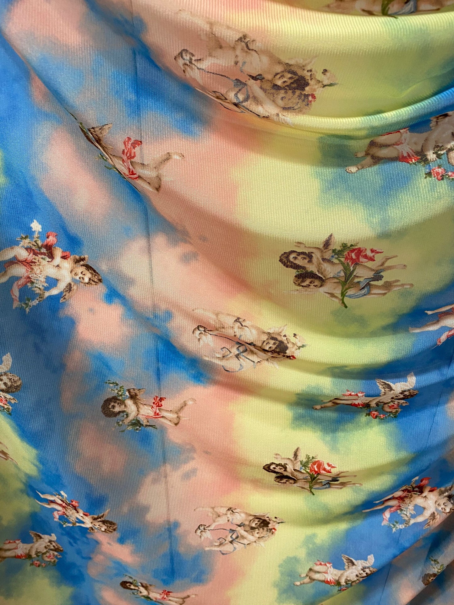 New Divine Angels design blush/blue/yellow print on power mesh 4-way stretch 58/60” Sold by the YD. Ships worldwide from Los Angeles