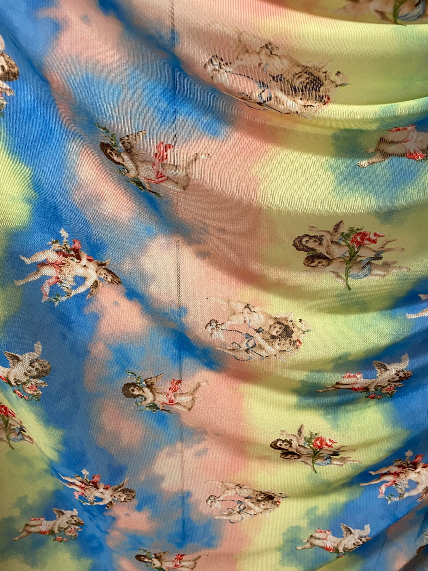 New Divine Angels design blush/blue/yellow print on power mesh 4-way stretch 58/60” Sold by the YD. Ships worldwide from Los Angeles