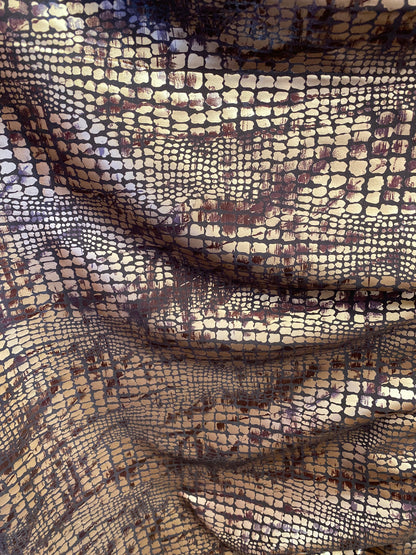 New Exotic animal print on metallic polyester non stretch 58/60” Sold by the YD. Ships Worldwide from Los Angeles California USA.