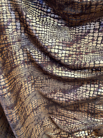 New Exotic animal print on metallic polyester non stretch 58/60” Sold by the YD. Ships Worldwide from Los Angeles California USA.