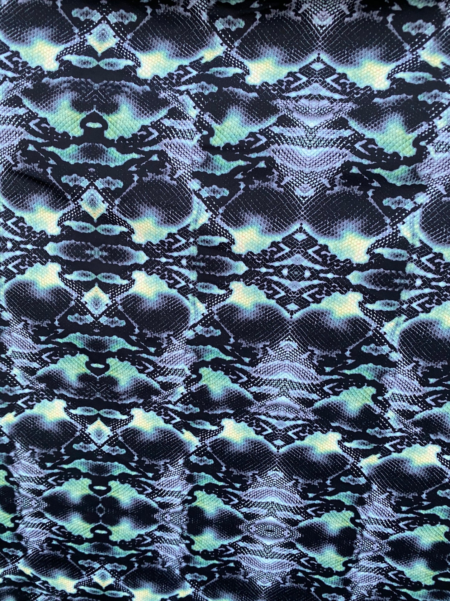 Serpent design Black/Green print on nylon spandex 4-way stretch 58/60” Sold  by the YD. Ships worldwide from Los Angeles California USA.
