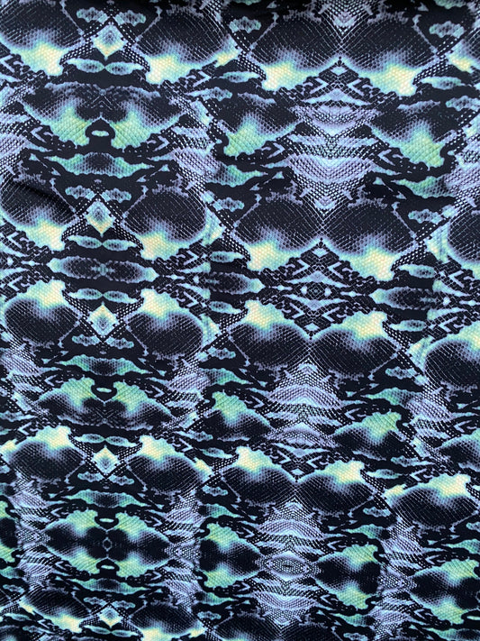 Serpent design Black/Green print on nylon spandex 4-way stretch 58/60” Sold  by the YD. Ships worldwide from Los Angeles California USA.