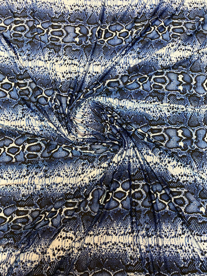 New snake skin sapphire/blue color print on poly spandex light weight 4-way stretch 58/60” Sold by the YD. Ships Worldwide from Los Angeles