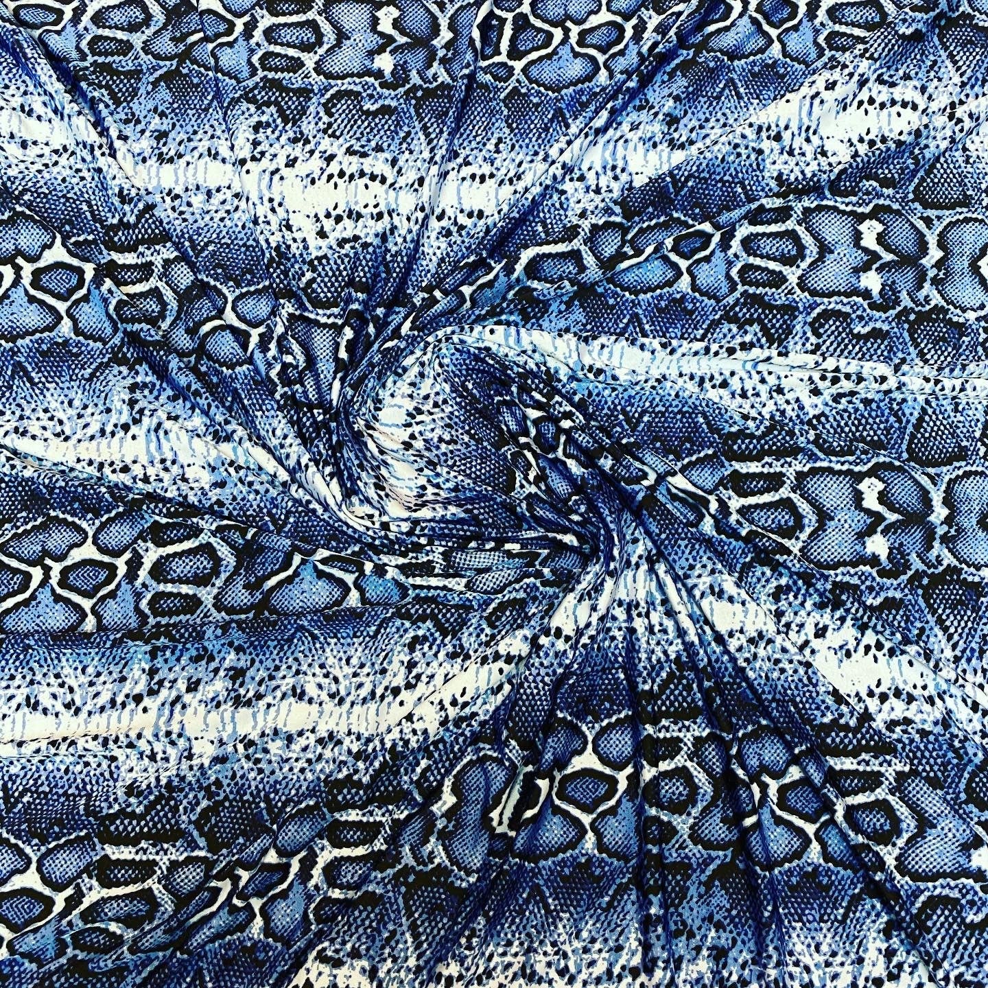 New snake skin sapphire/blue color print on poly spandex light weight 4-way stretch 58/60” Sold by the YD. Ships Worldwide from Los Angeles