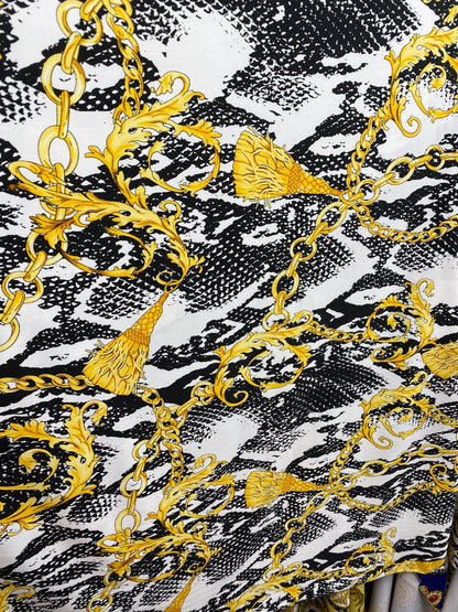 New brand design animal print with gold chains and tassels print on poly spandex 4-way stretch medium weight 58/60” Sold by the YD.