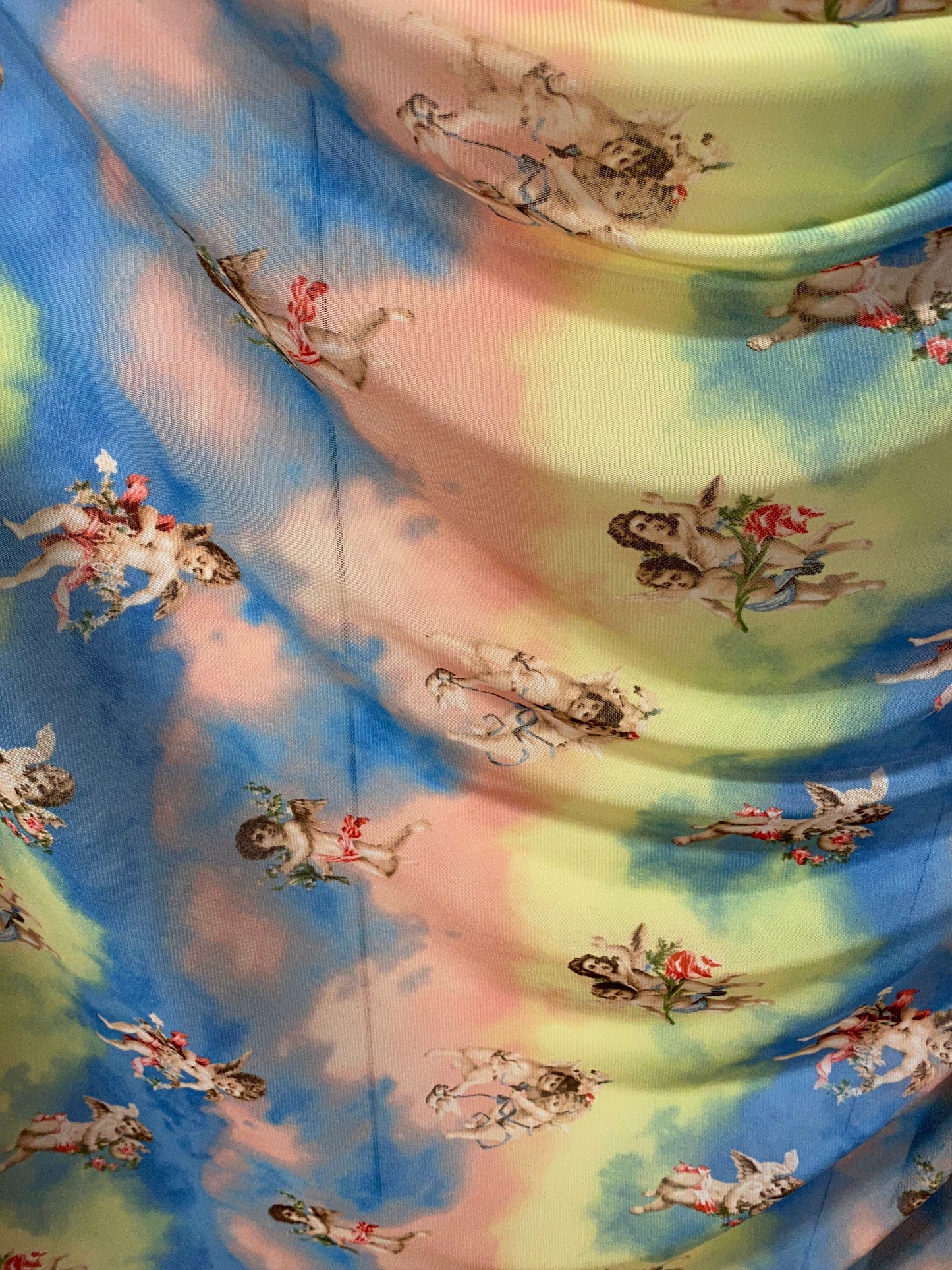 New Divine Angels design blush/blue/yellow print on power mesh 4-way stretch 58/60” Sold by the YD. Ships worldwide from Los Angeles