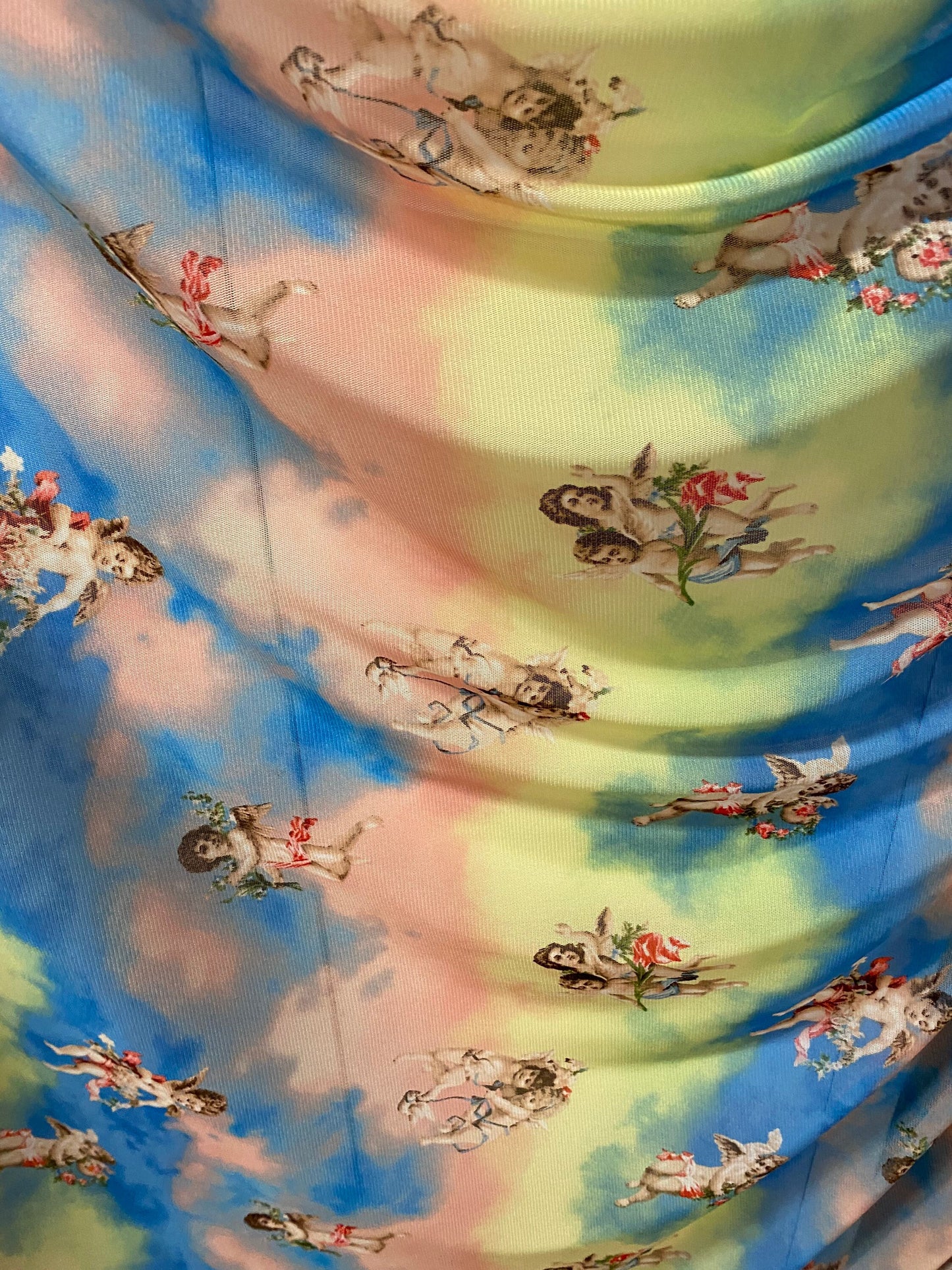 New Divine Angels design blush/blue/yellow print on power mesh 4-way stretch 58/60” Sold by the YD. Ships worldwide from Los Angeles