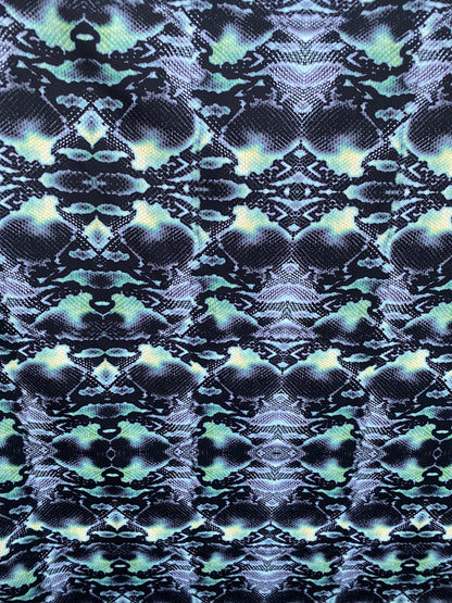 Serpent design Black/Green print on nylon spandex 4-way stretch 58/60” Sold  by the YD. Ships worldwide from Los Angeles California USA.
