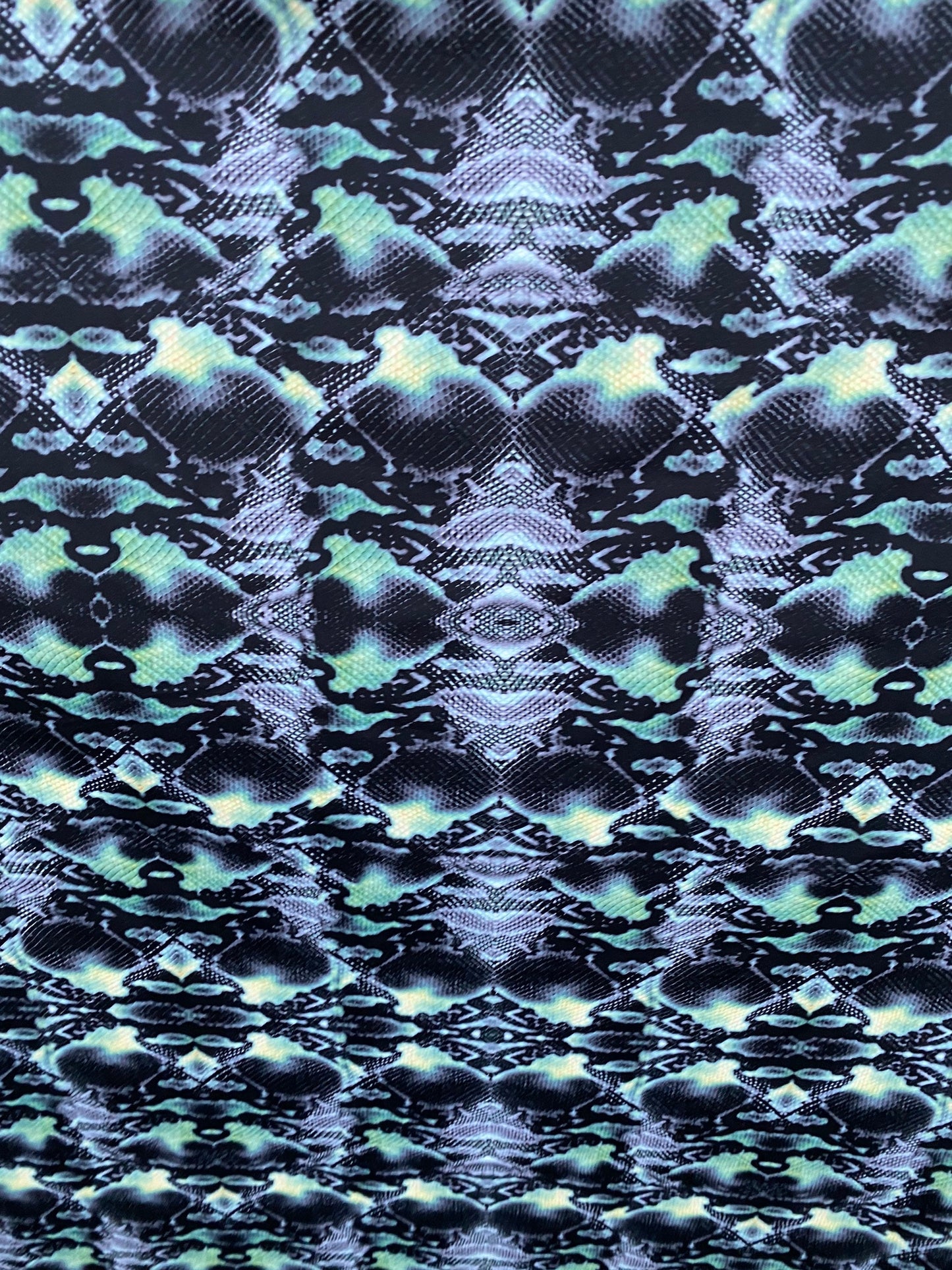 Serpent design Black/Green print on nylon spandex 4-way stretch 58/60” Sold  by the YD. Ships worldwide from Los Angeles California USA.
