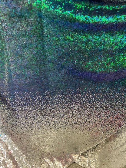 New Ombré design print on  iridescent mini cosmic sequins embroidered on stretch mesh 2-way 55/57” Sold by the YD. Ships Worldwide