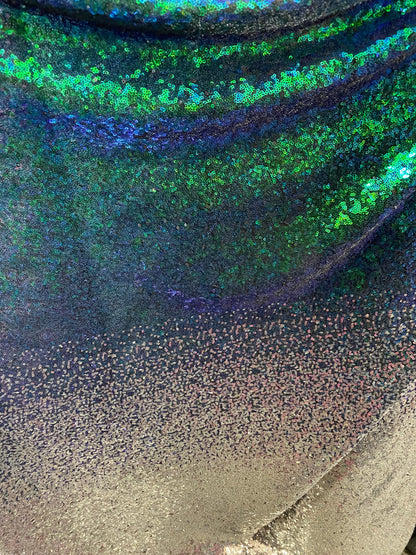 New Ombré design print on  iridescent mini cosmic sequins embroidered on stretch mesh 2-way 55/57” Sold by the YD. Ships Worldwide