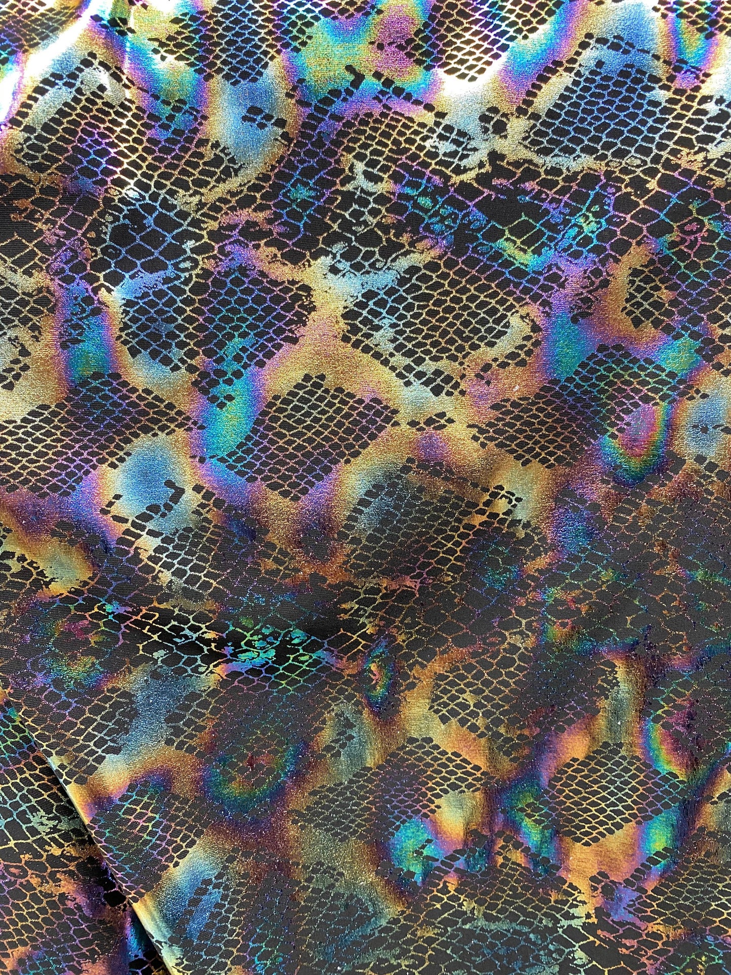 New Exotic cobra design Iridescent black hologram foil print on poly spandex 4-way stretch 58/60” Sold by the YD. Ships Worldwide from L.A