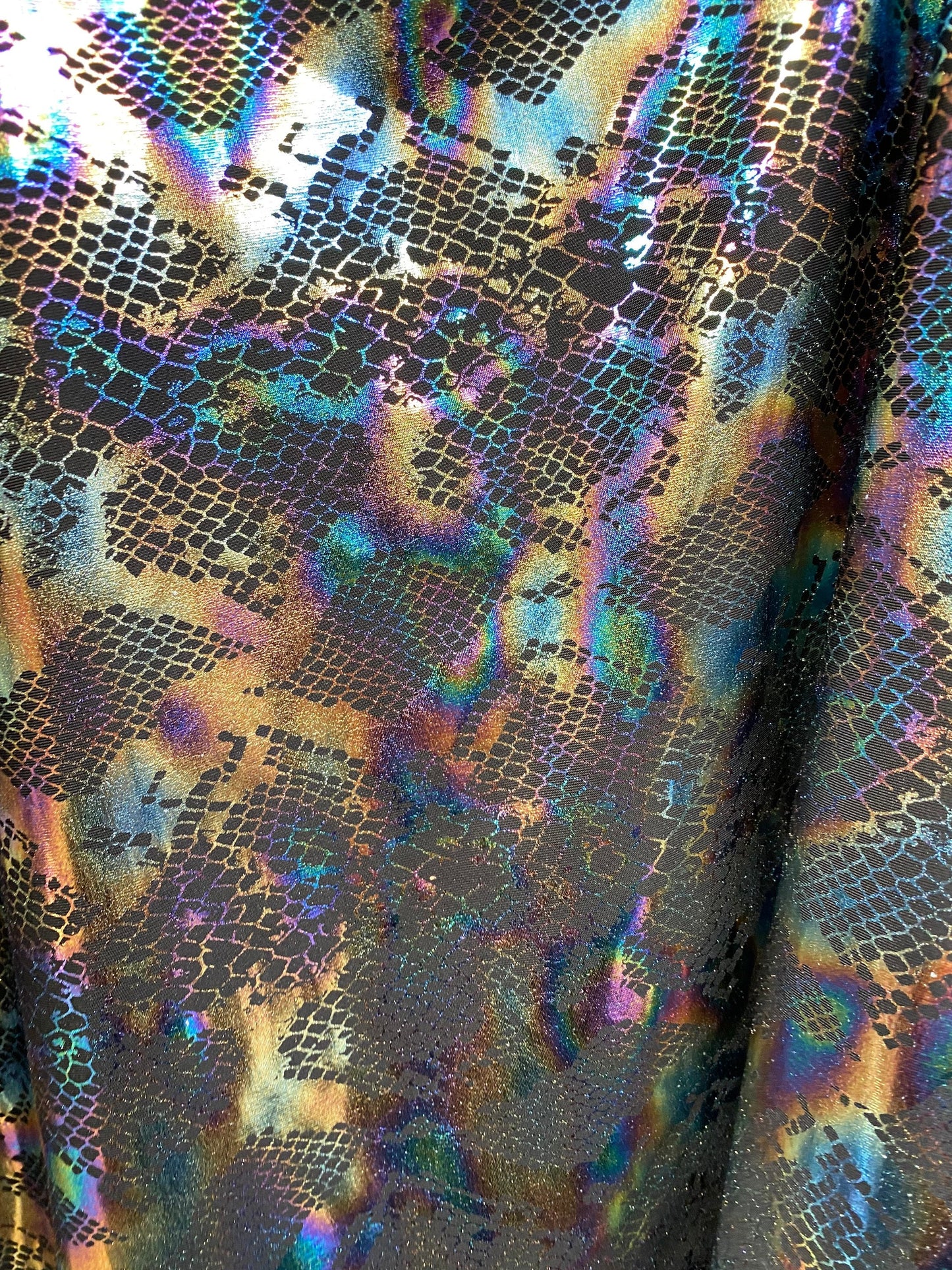 New Exotic cobra design Iridescent black hologram foil print on poly spandex 4-way stretch 58/60” Sold by the YD. Ships Worldwide from L.A