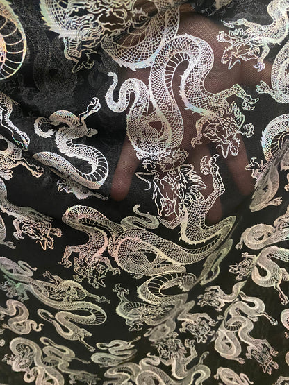 New Exotic Dragon design print on metallic power mesh nylon spandex 4-way stretch 58/60” Sold by the YD. Ships worldwide