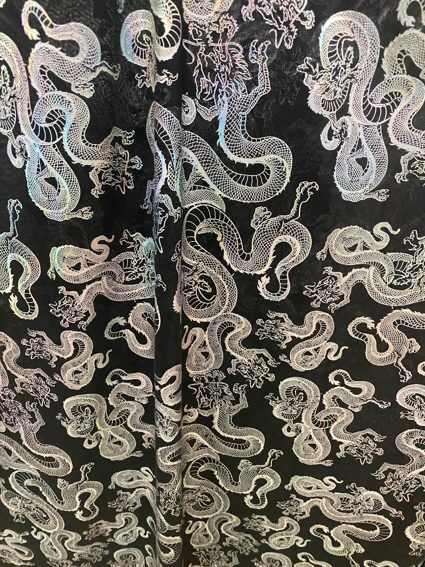 New Exotic Dragon design print on metallic power mesh nylon spandex 4-way stretch 58/60” Sold by the YD. Ships worldwide
