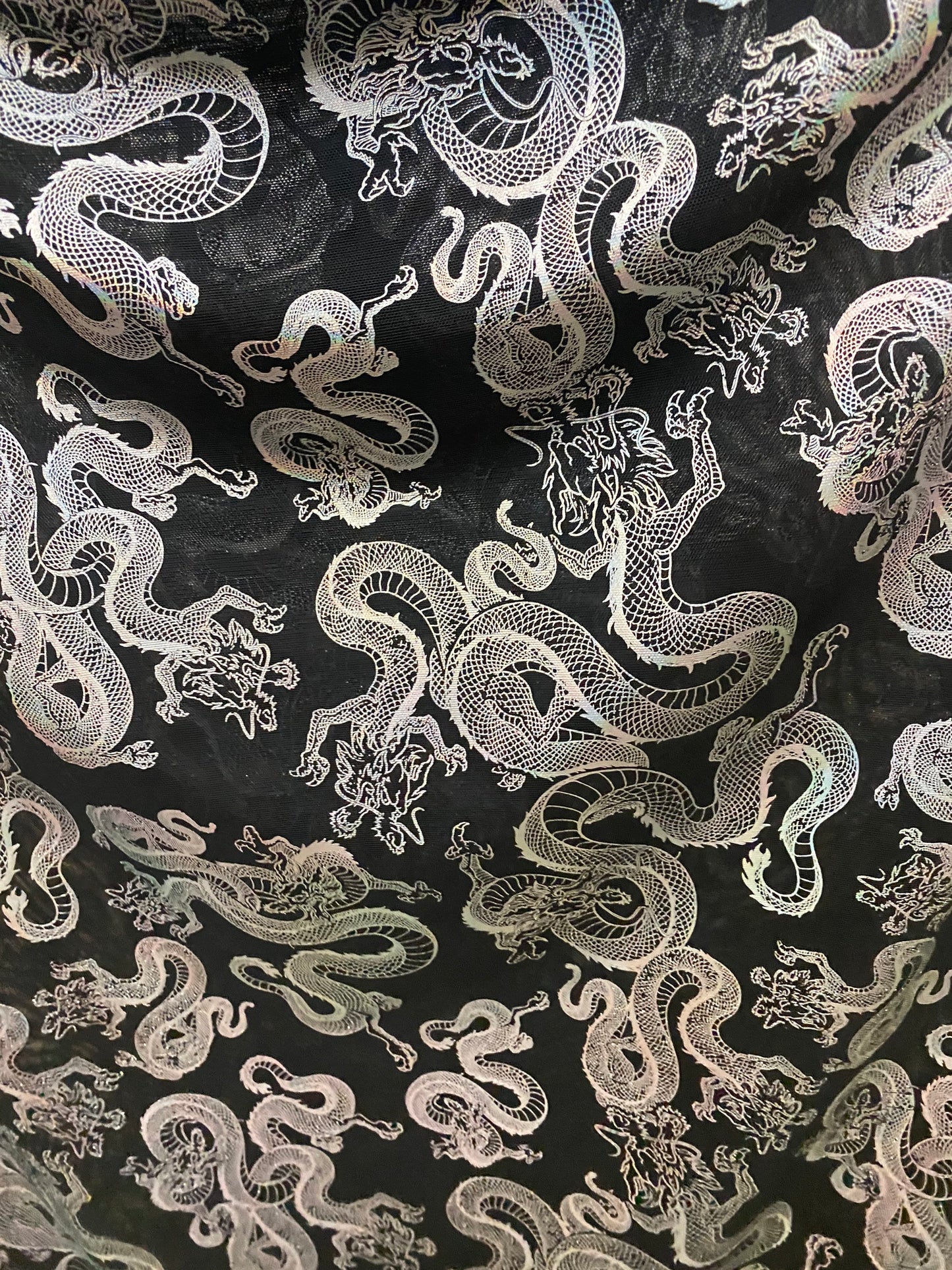 New Exotic Dragon design print on metallic power mesh nylon spandex 4-way stretch 58/60” Sold by the YD. Ships worldwide