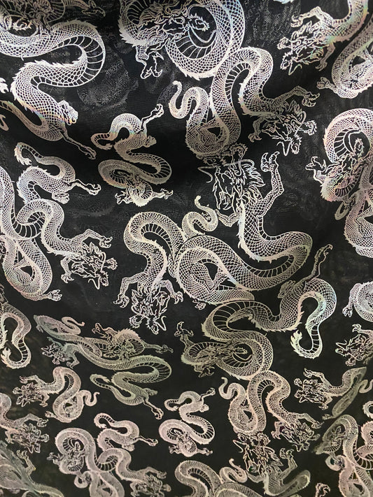 New Exotic Dragon design print on metallic power mesh nylon spandex 4-way stretch 58/60” Sold by the YD. Ships worldwide