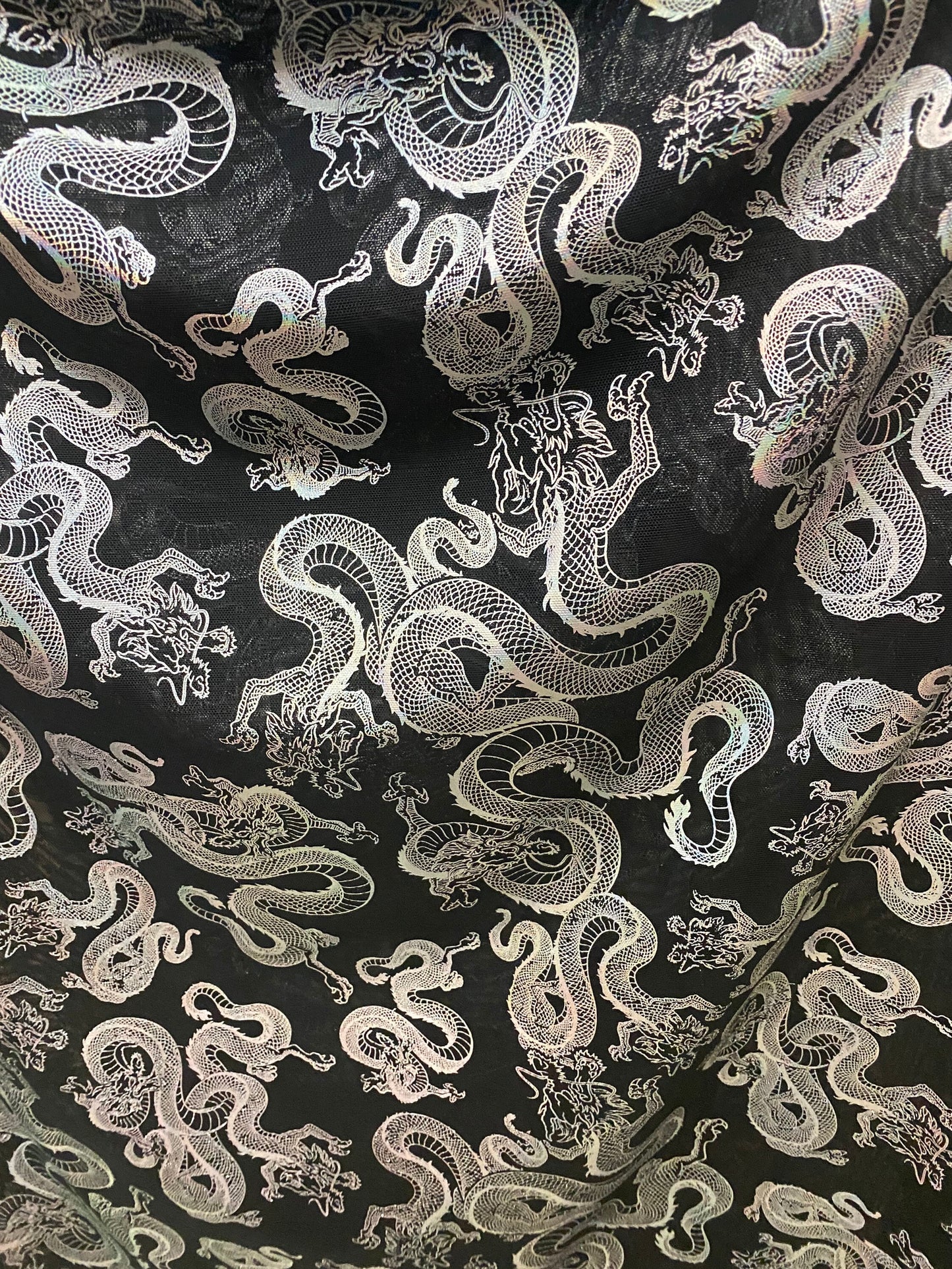 New Exotic Dragon design print on metallic power mesh nylon spandex 4-way stretch 58/60” Sold by the YD. Ships worldwide