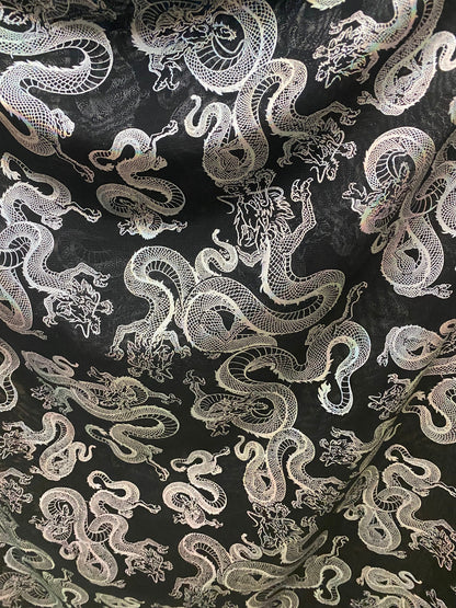 New Exotic Dragon design print on metallic power mesh nylon spandex 4-way stretch 58/60” Sold by the YD. Ships worldwide