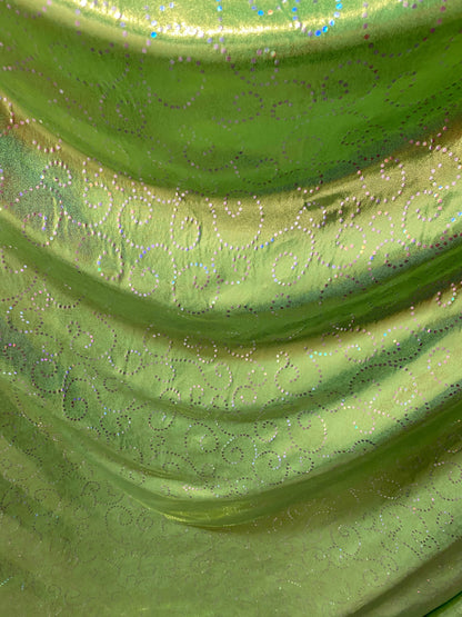 New Swirl design print on poly spandex with foggy foil 4-way stretch medium weight 58/60” Sold by the YD. Ships Worldwide