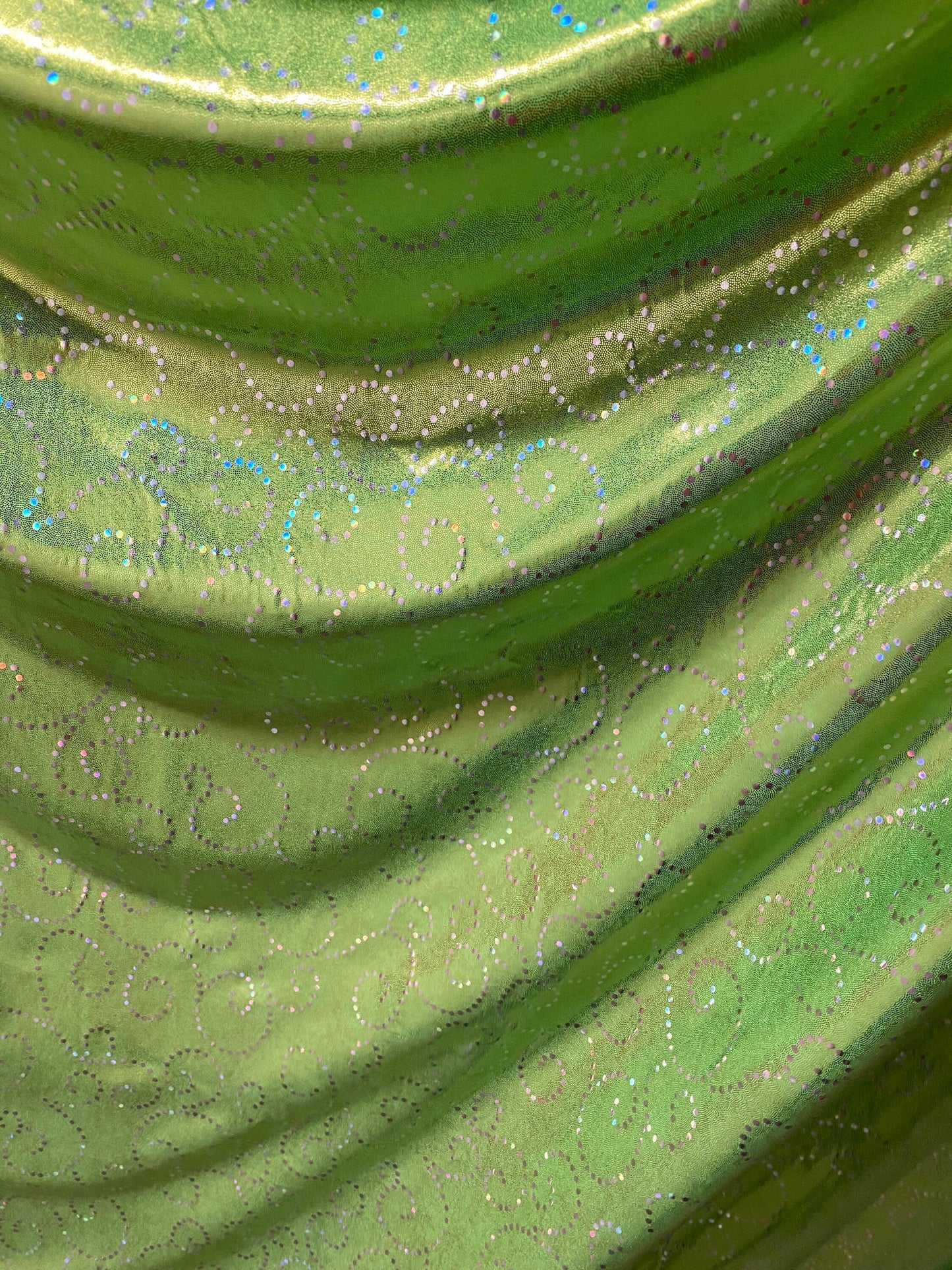 New Swirl design print on poly spandex with foggy foil 4-way stretch medium weight 58/60” Sold by the YD. Ships Worldwide