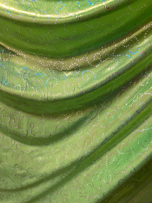 New Swirl design print on poly spandex with foggy foil 4-way stretch medium weight 58/60” Sold by the YD. Ships Worldwide