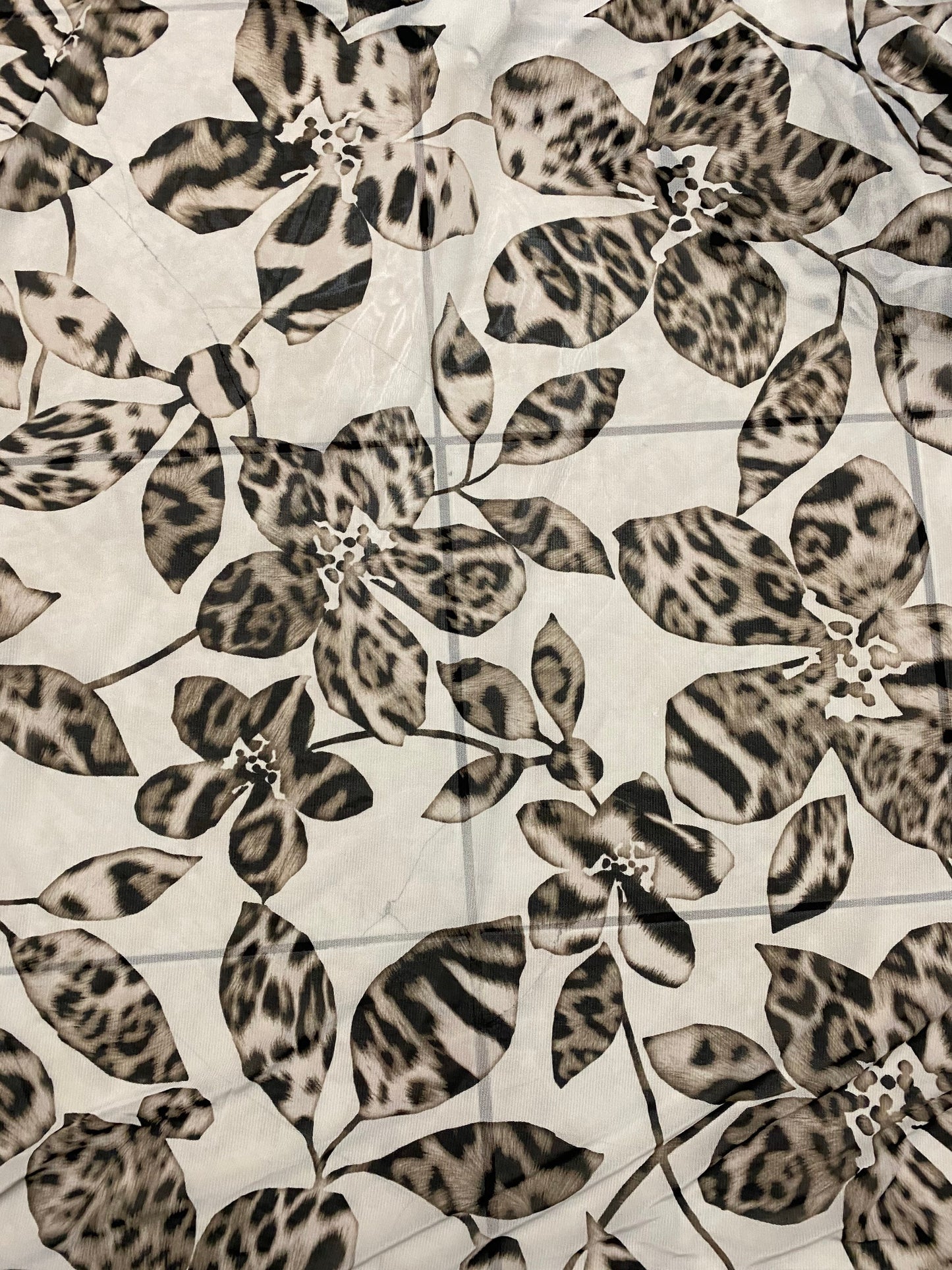 New Exotic flower animal print design on poly mesh 4-way stretch 58/60” Sold by the YD. Ships Worldwide from Los Angeles California USA.