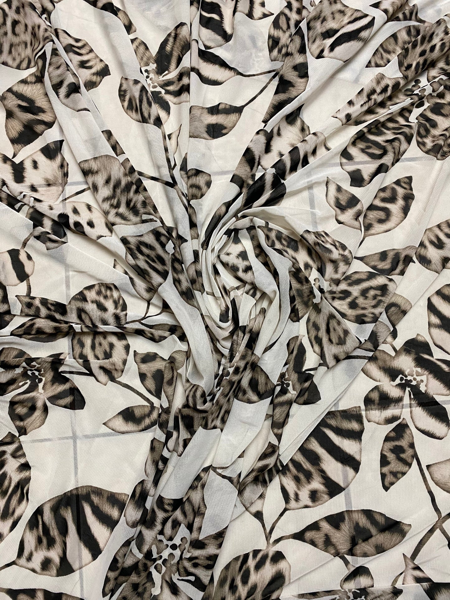 New Exotic flower animal print design on poly mesh 4-way stretch 58/60” Sold by the YD. Ships Worldwide from Los Angeles California USA.
